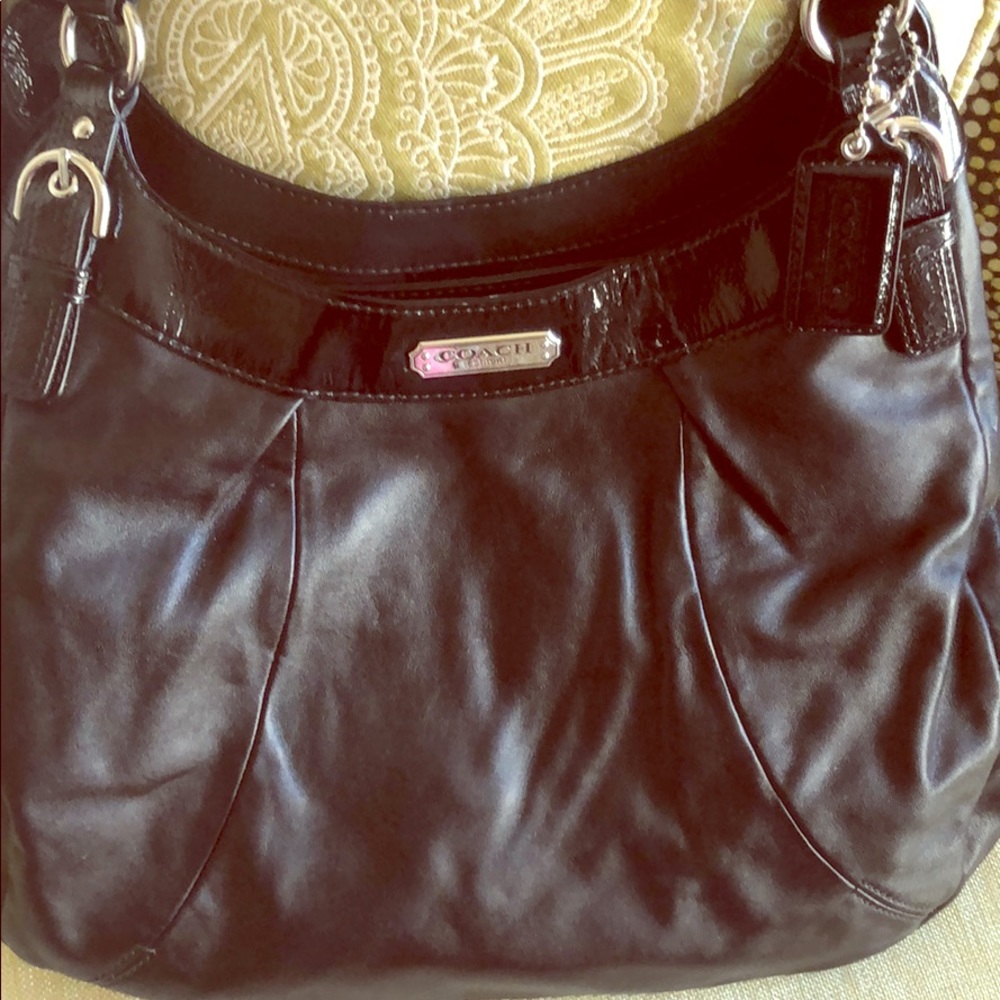 Black Coach bag with patent leather accents